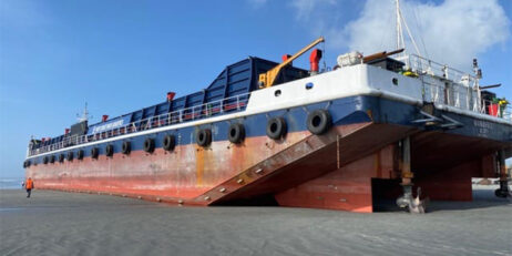 Tug heading to grounded barge